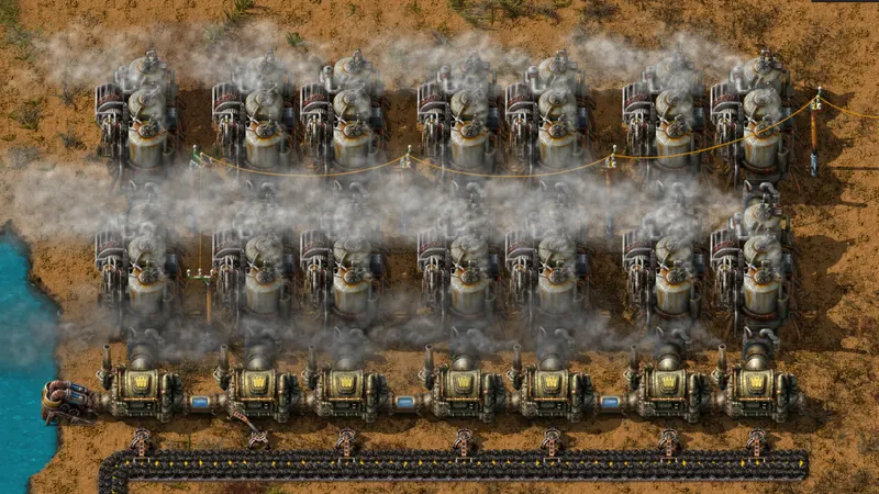 Bloc d énergie vapeur Factorio avec pompe offshore, chaudières alignées et machines à vapeur reliées au réseau