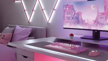 Bureau avec éclairage rose aux couleurs du PC avec une balle Pokémon