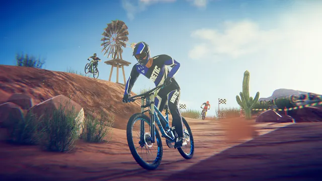 Descendeur de VTT dévalant une piste montagneuse dans Descenders, visuel officiel pour identifier le jeu avant de chercher un code PS5