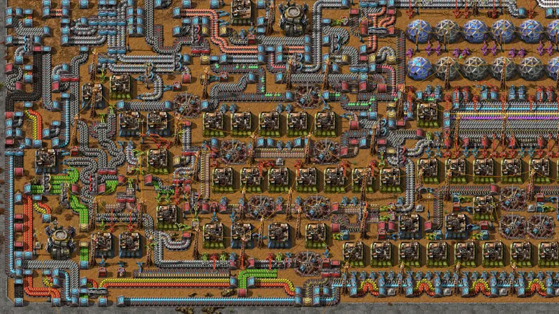 Vue de jeu officielle de Factorio accompagnant l’automatisation du charbon et le stockage de la pierre