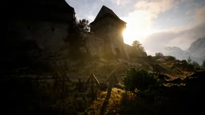 The Blood of Dawnwalker gameplay montre une forteresse baignée de lumière au cœur du monde ouvert