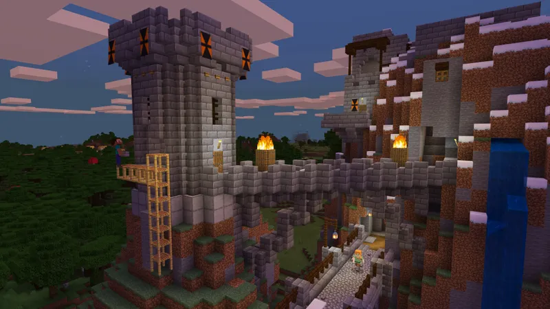 Joueurs Minecraft construisant une forteresse et une tour sur une colline