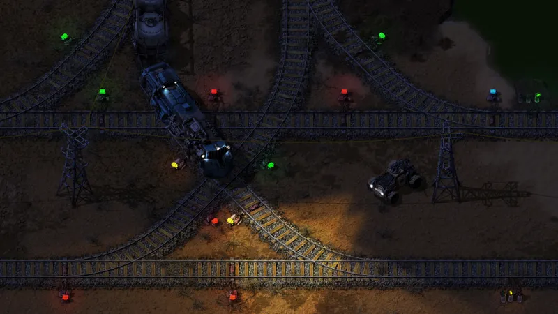 Intersection ferroviaire Factorio avec signaux colorés pour éviter les blocages des trains de pétrole