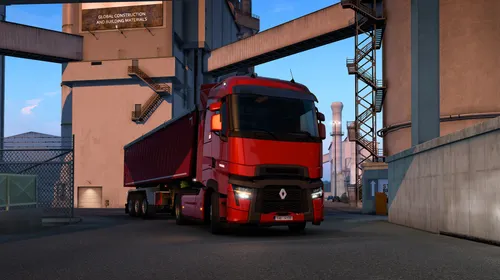 Euro Truck Simulator 2 montrant un camion roulant sur une autoroute au coucher du soleil