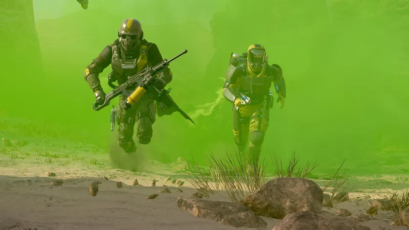 Escouade Helldivers 2 utilisant des effets de gaz et des tirs croises pour bloquer une avancee ennemie pendant une defense