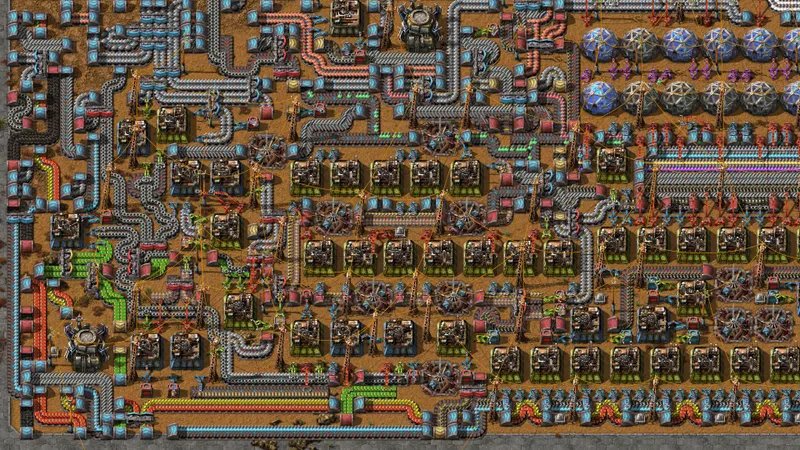 Capture officielle de Factorio montrant une base avancée organisée en modules répétés