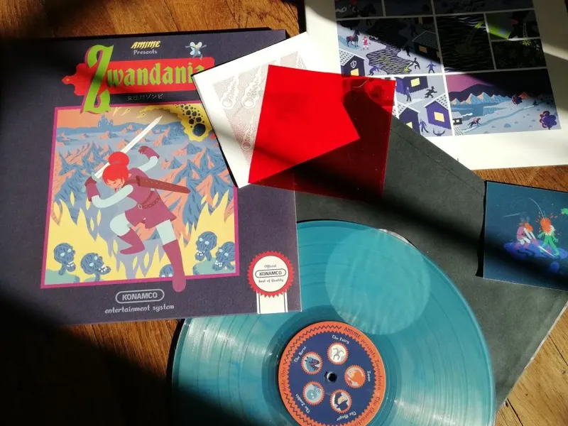 L'objet Zwandania englobe une BD, un vinyle et des images en petit portrait