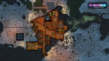 Colonie RimWorld compacte avec bâtiments, réserves et zones de travail organisées pour stabiliser les premiers jours