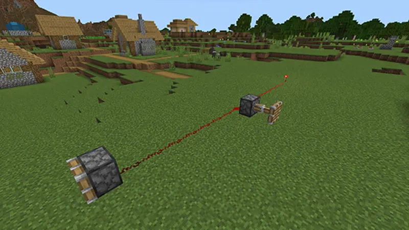 Composants de redstone alignés dans Minecraft pour observer la sortie et le délai d’un répéteur.