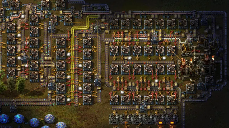 Capture officielle de Factorio montrant une zone industrielle étendue, utile pour visualiser une pose en série à grande échelle