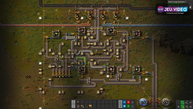 Base Factorio de début de partie montrant des tapis jaunes, des assembleurs et des laboratoires encore proches de la production initiale