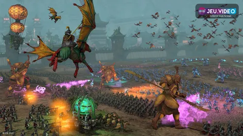 Bataille de Total War WARHAMMER III montrant des armées en formation sur un terrain ouvert.